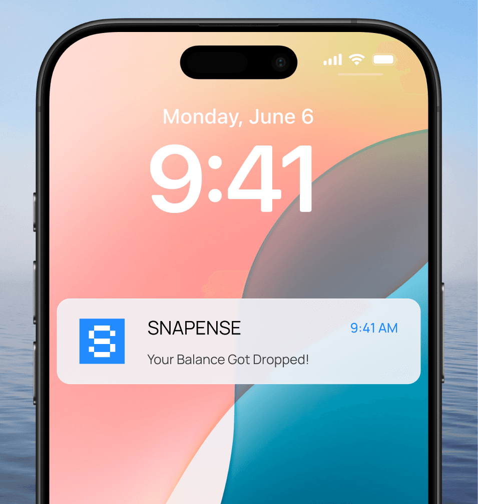 Phone lock screen with Snapense balance drop alert